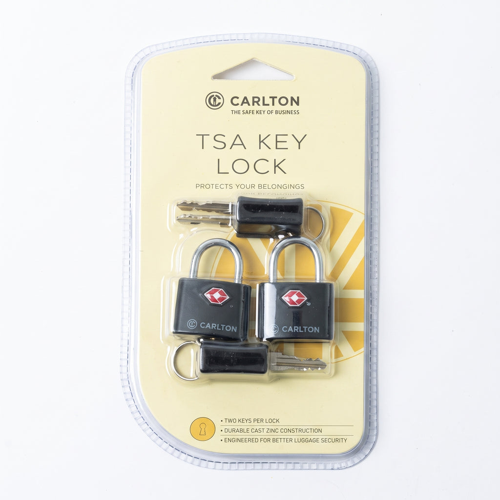 A package of two Carlton TSA key locks with two keys each, sealed in clear plastic blister packaging on a cream-colored backing card.
