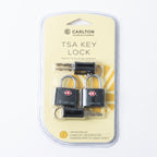 A package of two Carlton TSA key locks with two keys each, sealed in clear plastic blister packaging on a cream-colored backing card.