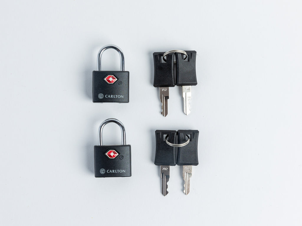 Two black Carlton padlocks with keys arranged vertically on a clean white background.